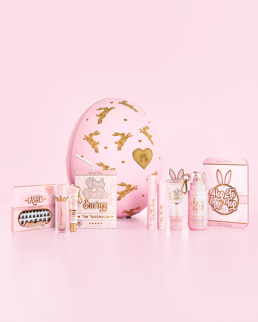 Pink P.Louise beauty Easter Egg surrounded by pink marshmallow scented makeup, skincare and bodycare products against a pink background