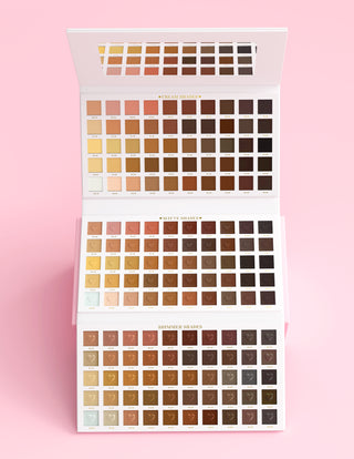 An XXXL Wedding Wish eyeshadow Palette by P.Louise that is open showing all the shades against a pink background