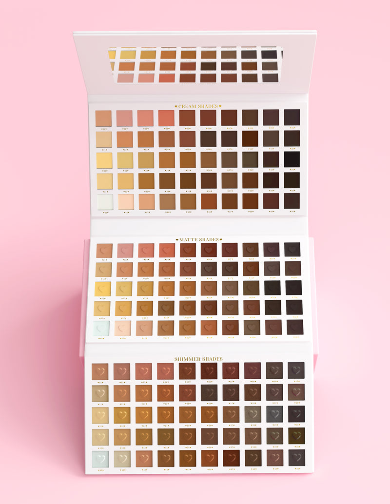 An XXXL Wedding Wish eyeshadow Palette by P.Louise that is open showing all the shades against a pink background