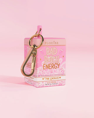 Pink lemonade scented keychain lip balm packaging with 'Bad Bitch Energy' text on a pink background