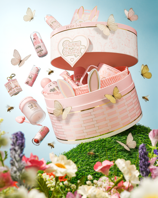 Pink P.Louise Easter basket with cosmetic items surrounded by butterflies and flowers on a blue background