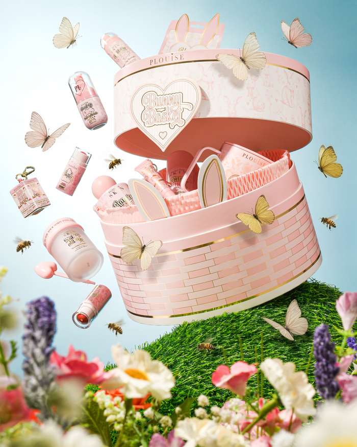 Pink P.Louise Easter basket with cosmetic items surrounded by butterflies and flowers on a blue background
