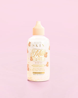 A bottle of the P.Louise Milk It Melt Milky Eye Makeup Remover in coconut cake scent against a pink background
