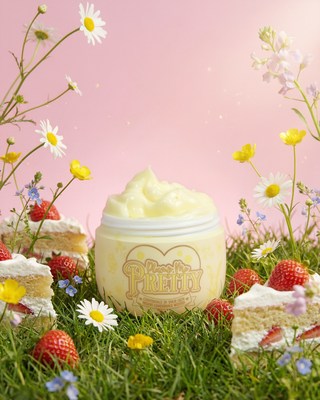 Yellow tub of Plump Me Pretty Moisturizer in strawberry shortcake