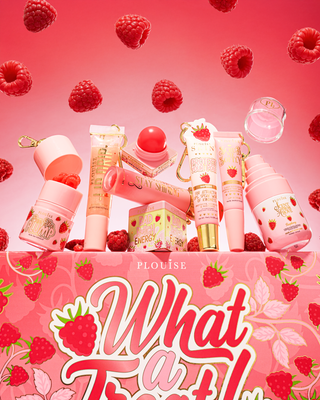 The P.Louise What A Treat Bundle collection of lip and beauty products surrounded by raspberries