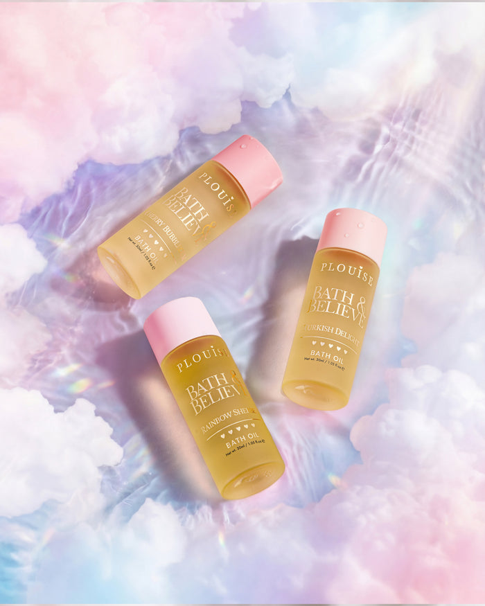 Three bottles of P.Louise Bath & Believe bath oil set featuring three scents - turkish delight, rainbow sherbet and cherry bubblegum