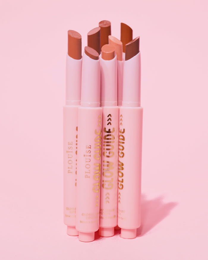 Set of P.Louise Glow Guide Glossy Lipstick Balms with applicators on a pink background