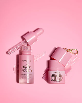 P.Louise Sippin Pretty Lip Duo featuring the lip loyalty peptide lip serum and pass the plump lip balm in cherry bubblegum